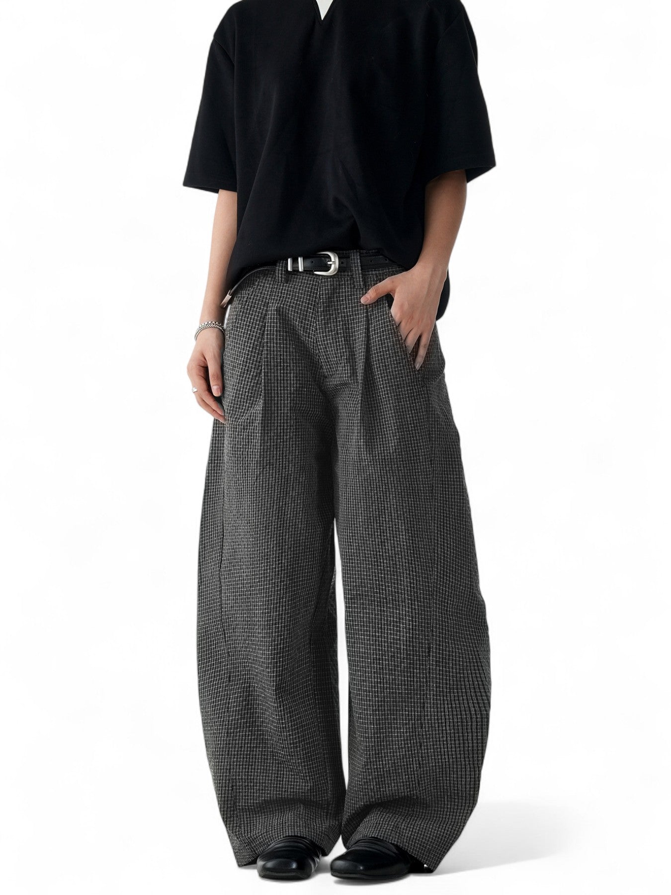 Unisex black plaid scimitar slacks featuring a loose