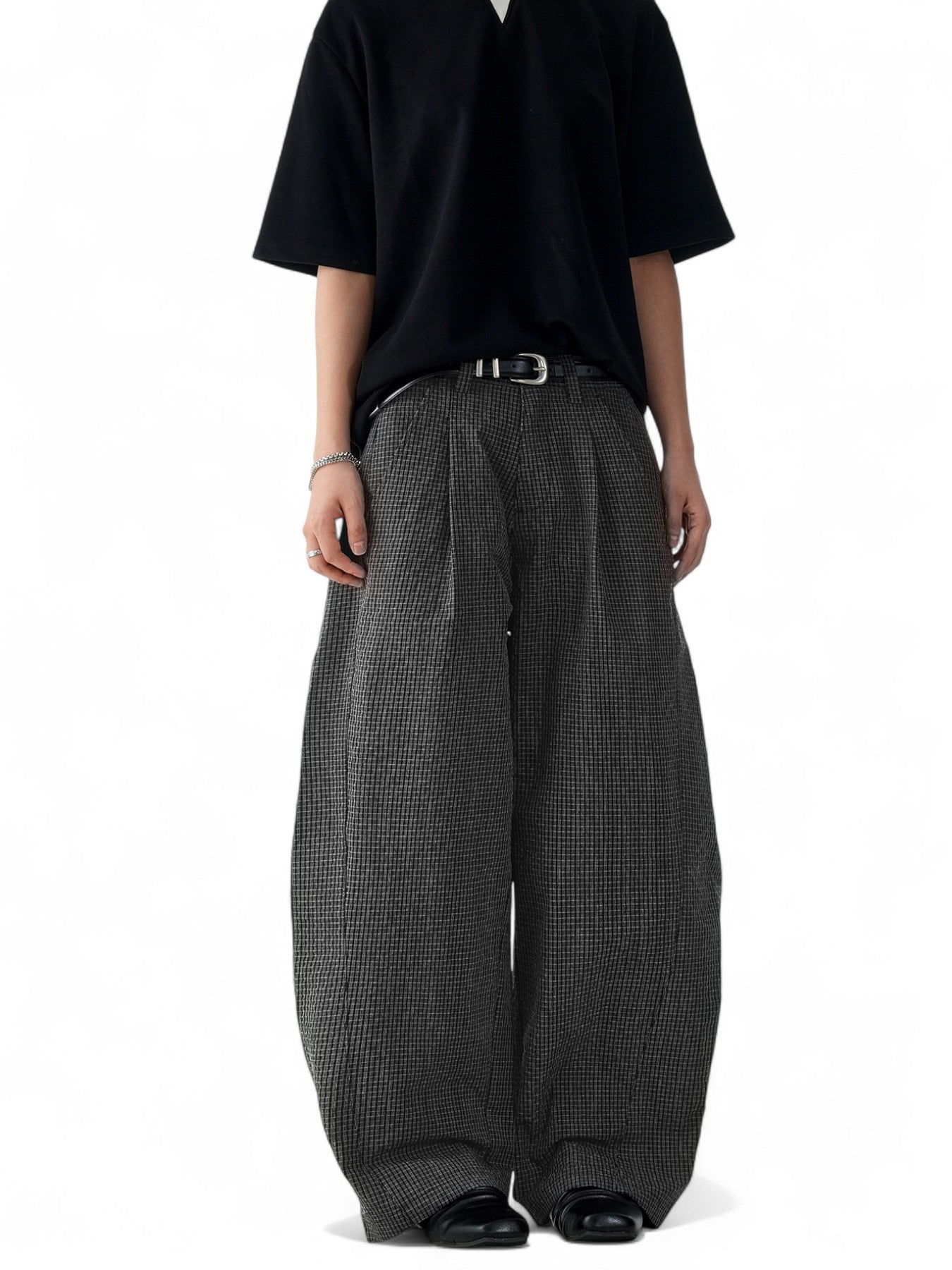 Unisex black plaid scimitar slacks featuring a loose