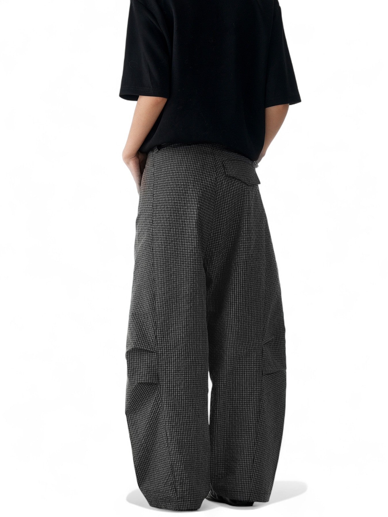Unisex black plaid scimitar slacks featuring a loose