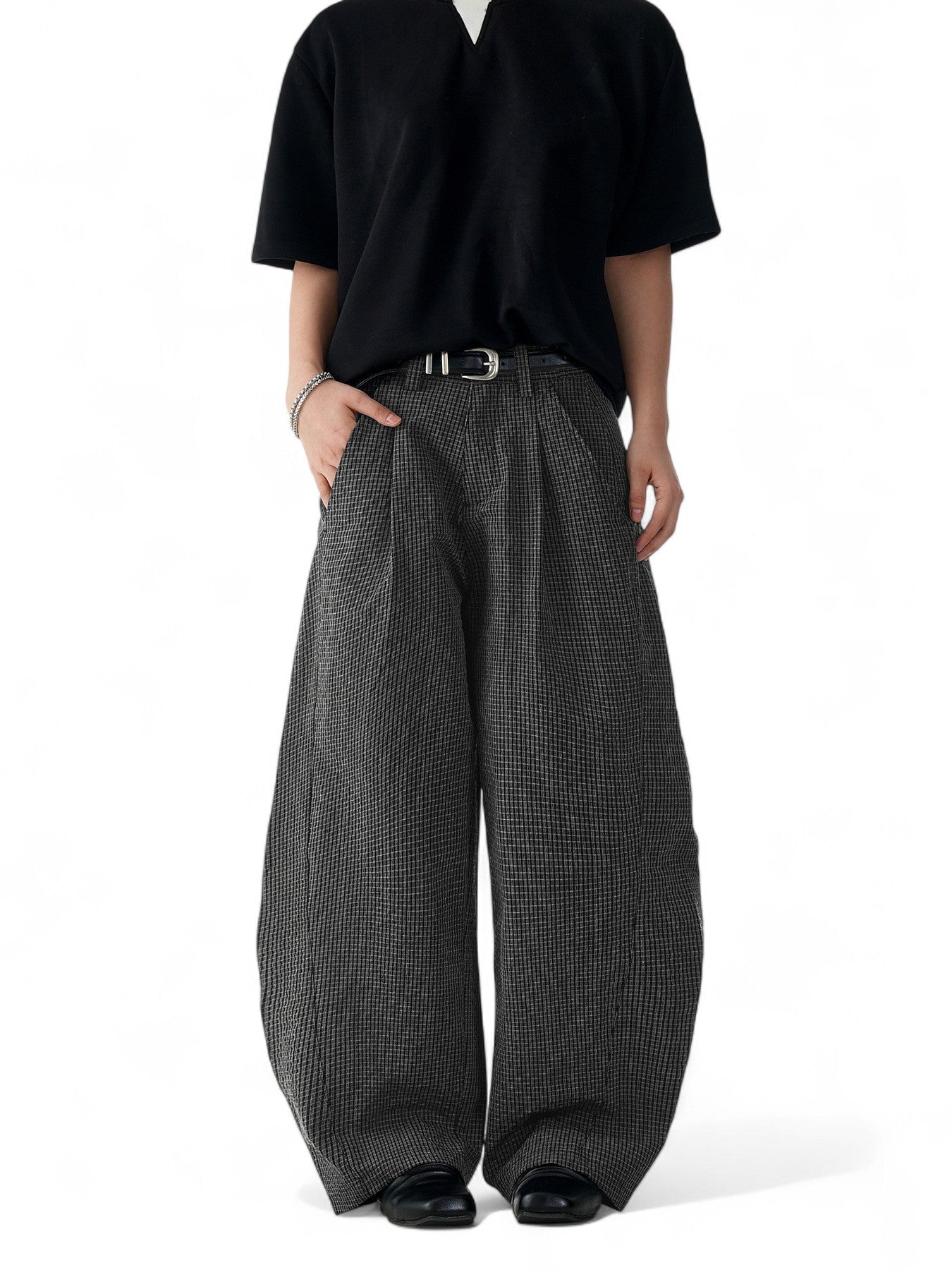 Unisex black plaid scimitar slacks featuring a loose
